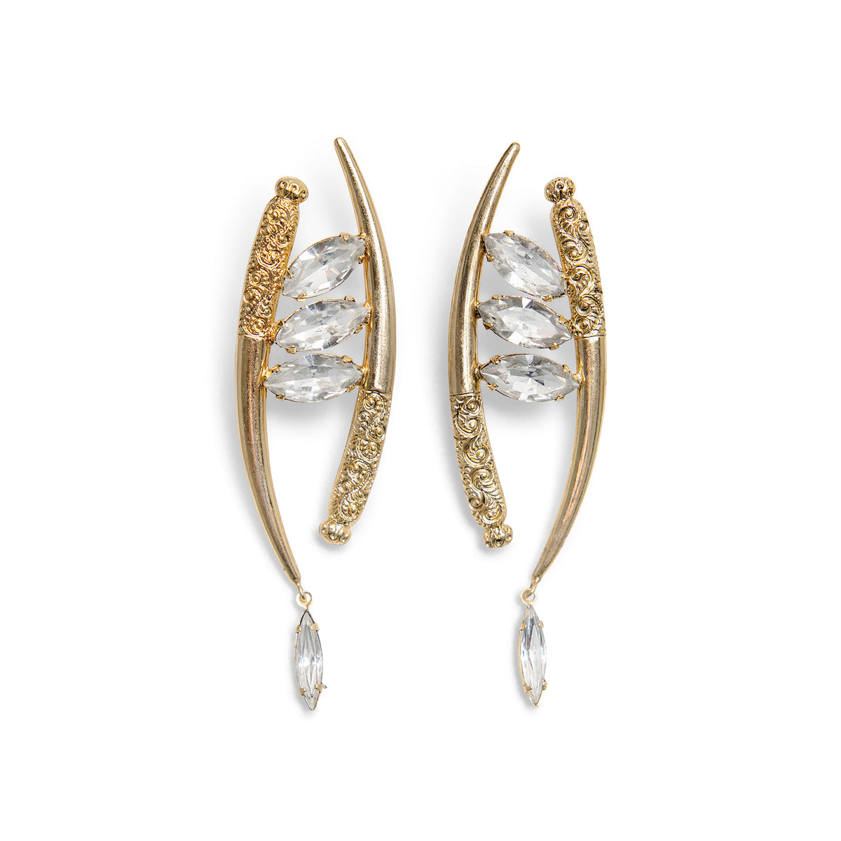 A pair of asymmetric gold crescent-shaped drop earrings featuring marquise-cut clear, Swarovski crystals and ornate gold filigree details, set against a plain white background.
